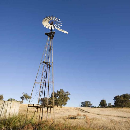 An iconic Aussie windmill and a water tank. An iconic Aussie windmill and a water tank.