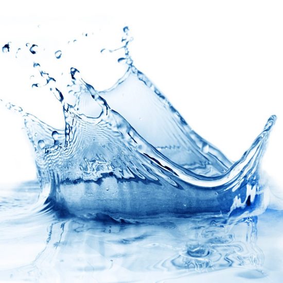 Fresh clean water splash in blue.